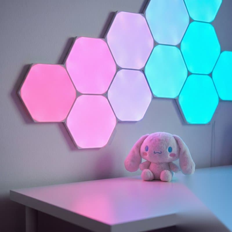 Aesthetic desk with hex light panels, warm lamp, and pixel lantern